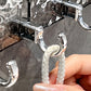 Punchless gegolfde roterende zuignaphanger